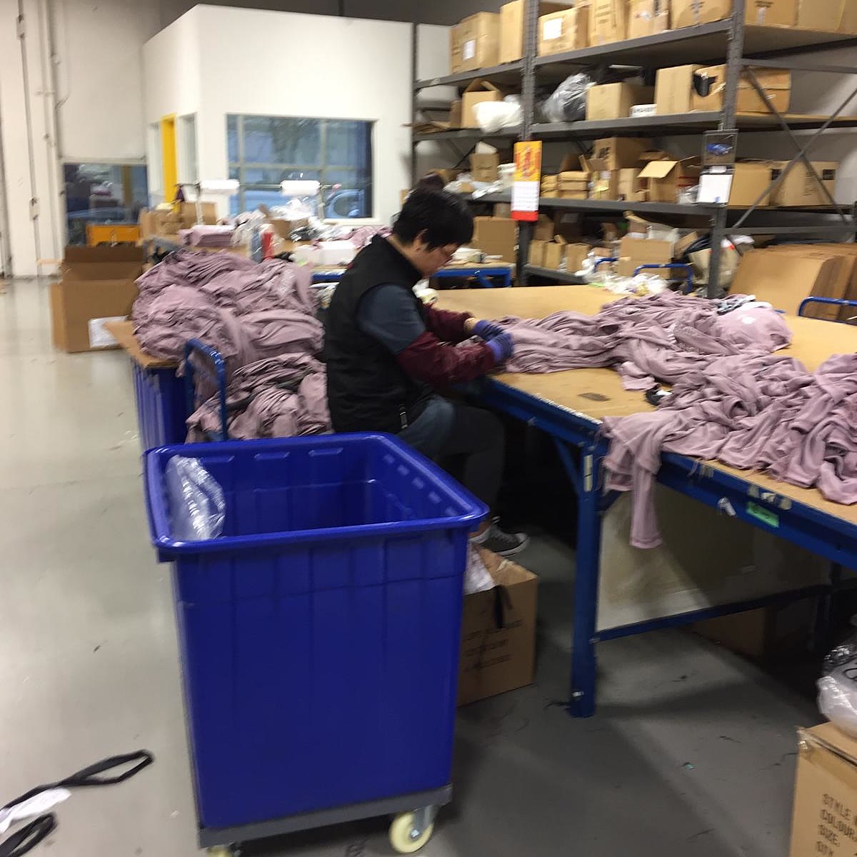 A team member finishing garments by hand